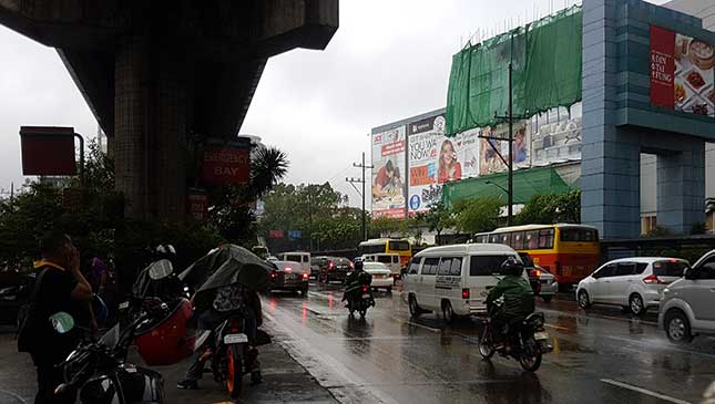 Motorcycle rides under an overpass